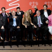 3929788441-colombian-pop-star-shakira-center-sits-next-to-businessmen-billionaires.jpg